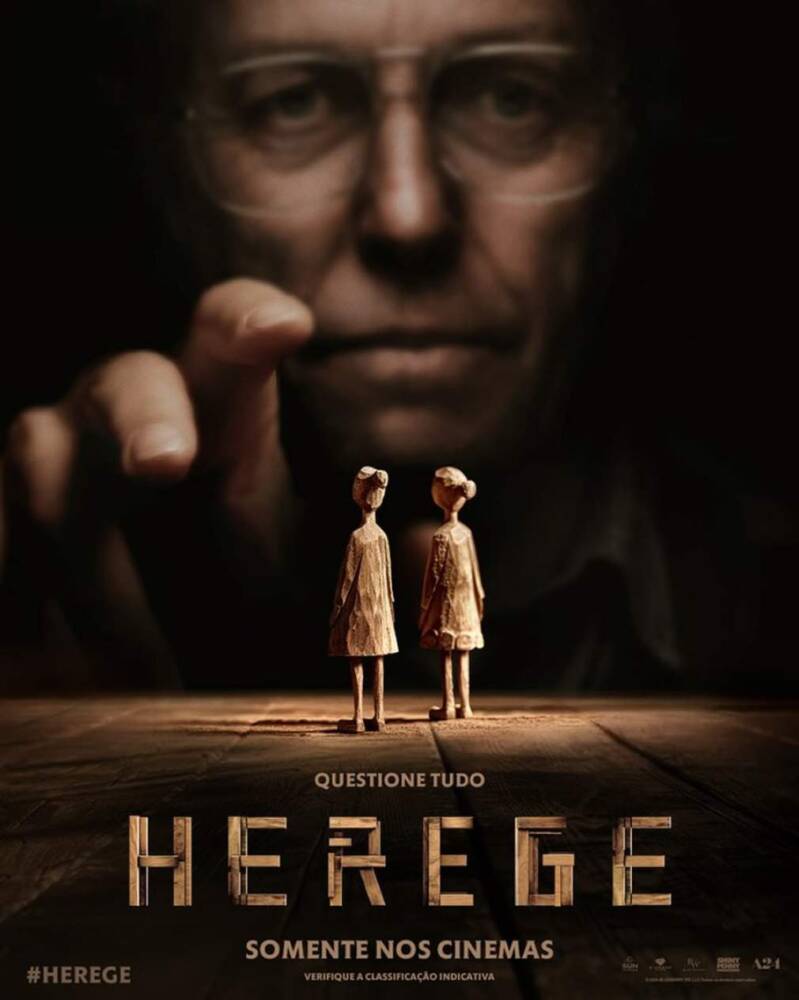 Cartaz do filme Herege, mãos e bonecos.