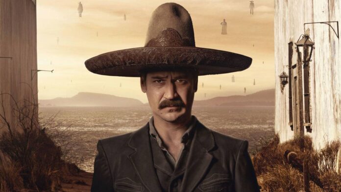 Homem com sombrero, deserto ao fundo.