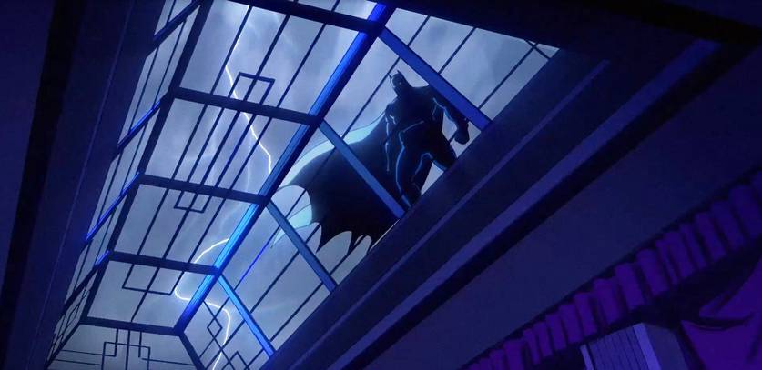 Silhueta do Batman em prédio iluminado por luz azul