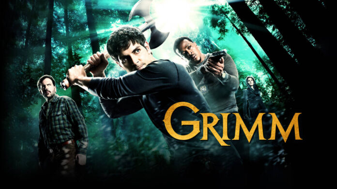 Personagens da série Grimm em floresta com armas